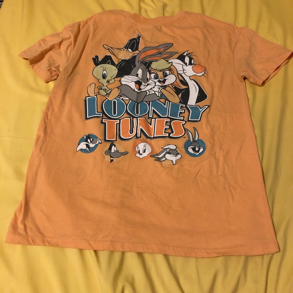 Light orange Looney Tunes t-shirt featuring Bugs Bunny, Lola, Sylvester, Tweety